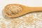 Whole Chinese Rice seed. Healthy grains on a wooden spoon. Whit