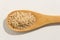 Whole Chinese Rice seed. Nutritious grains on a wooden spoon on
