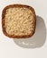 Whole Chinese Rice seed. Wicker basket with grains. Top view, h