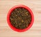 Whole cloves in a red dish on counter top view