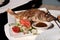 Whole cooked fish and salad