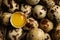 Whole, cracked quail eggs as background, top view