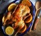 Whole crispy golden roast duck with marinated with fresh orange slices for a festive
