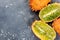 Whole and Cut Kiwano or Horned Melon Exotic Fruit on Concrete Border Background