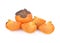 Whole and cut pieces fresh persimmon on white background