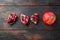 Whole and cute pomegranates over old dark wooden table, top view with space for text