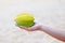 Whole exotic carambola fruit on a female hand