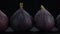 Whole figs isolated on black background. Sliding shot