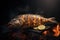 Whole fish cooking on flaming grill. Bbq food