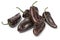 Whole fresh chocolate mini pointed bell peppers close up on white background