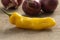 Whole fresh raw ripe yellow Madame Jeanette pepper close up