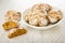 Whole gingerbread, broken gingerbread, plate with cookies on wooden table