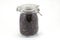 Whole grain black rice in a jar on white backgroun