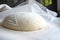 Whole grain bread dough rising on table