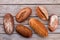 Whole grain bread on wooden background.