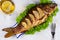 Whole grilled fish carp