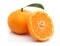 Whole and half tangerine on white background