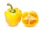 Whole and halved yellow pepper