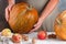 Whole large organic pumpkin in women`s hands