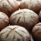 Whole loaves of dark bread in rows. Bread background. Close up. Fresh baked whole grain bread. Selective focus in the