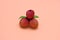 whole lychee fruits on peach background