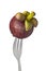Whole mangosteen held by a fork