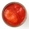 Whole open can of tomatoes isolated from above