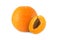 Whole orange and half apricot with stone isolated