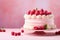 Whole raspberry cream cake on cake stand