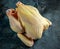 Whole Raw Corn Chicken for cooking. on stone background