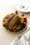 Whole roasted chicken with vegetables, dinner food