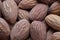 Whole shelled almonds as food background