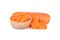 whole, slice and cut carrot cube in wooden bowl on white background