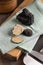 Whole and sliced black truffles mushroom on wooden board on green napkin, close up