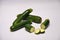 Whole and sliced courgettes on a seamless background