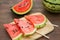 Whole and sliced delicious ripe watermelon on wooden table