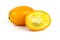 Whole and sliced kumquat fruits