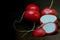 Whole and sliced radish on a black background