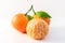 Whole tangerines or mandarines orange fruits and peeled segments