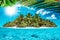 Whole tropical island within atoll in tropical Ocean on a summer day. Uninhabited and wild subtropical isle with palm trees.