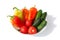 Whole Vegetables Cucumbers, Bell Peppers and Tomatos red green yellow orange in water drops on white background Isolated top view