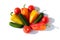Whole Vegetables Cucumbers, Bell Peppers and Tomatos red green yellow orange in water drops on white background Isolated top view