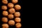 Whole walnuts and cleared on old black metal background, top view. Space for text