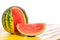 Whole watermelon with cut slice. Summer refreshment image with c