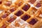 Whole wheat Belgium waffle with maple syrup close up as background