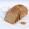 Whole wheat grain bread slice slices sliced loaf square on wooden board