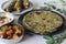 Whole wheat methi thepla rolls with paneer capsicum filling and a bowl of masala curd