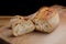 Whole wheat sliced bread on wooden board. Freshly baked traditional bread on wooden table. Healthy food