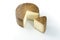 Whole wheel of sheep milk cheese over white background