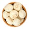 Whole white champignon mushrooms in wooden bowl